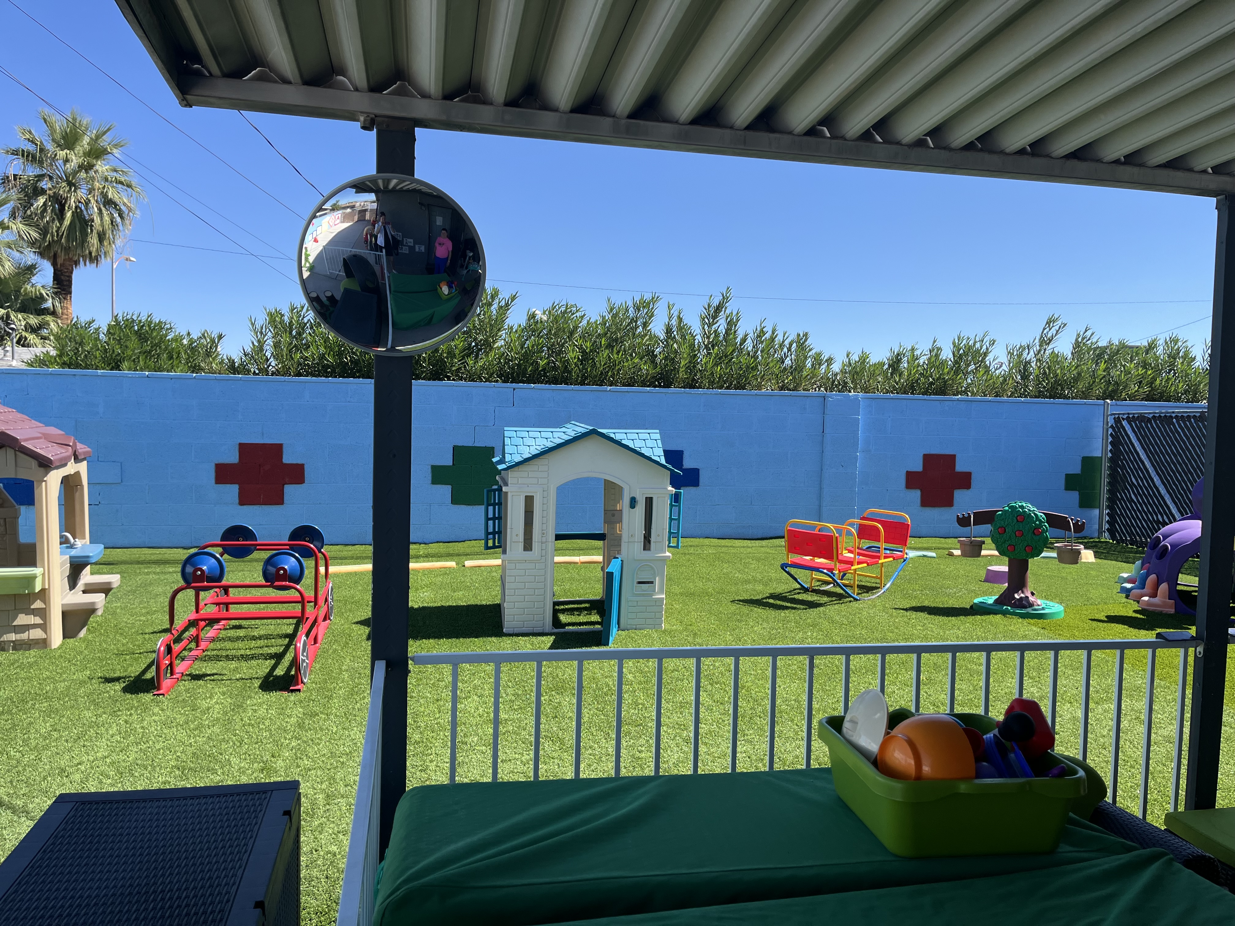 Outdoor toddler play area. Colorful, green grass. 