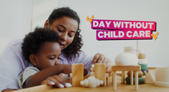 Childcare taker sits with toddler at a table while the little boy plays with toy blocks on the table. 