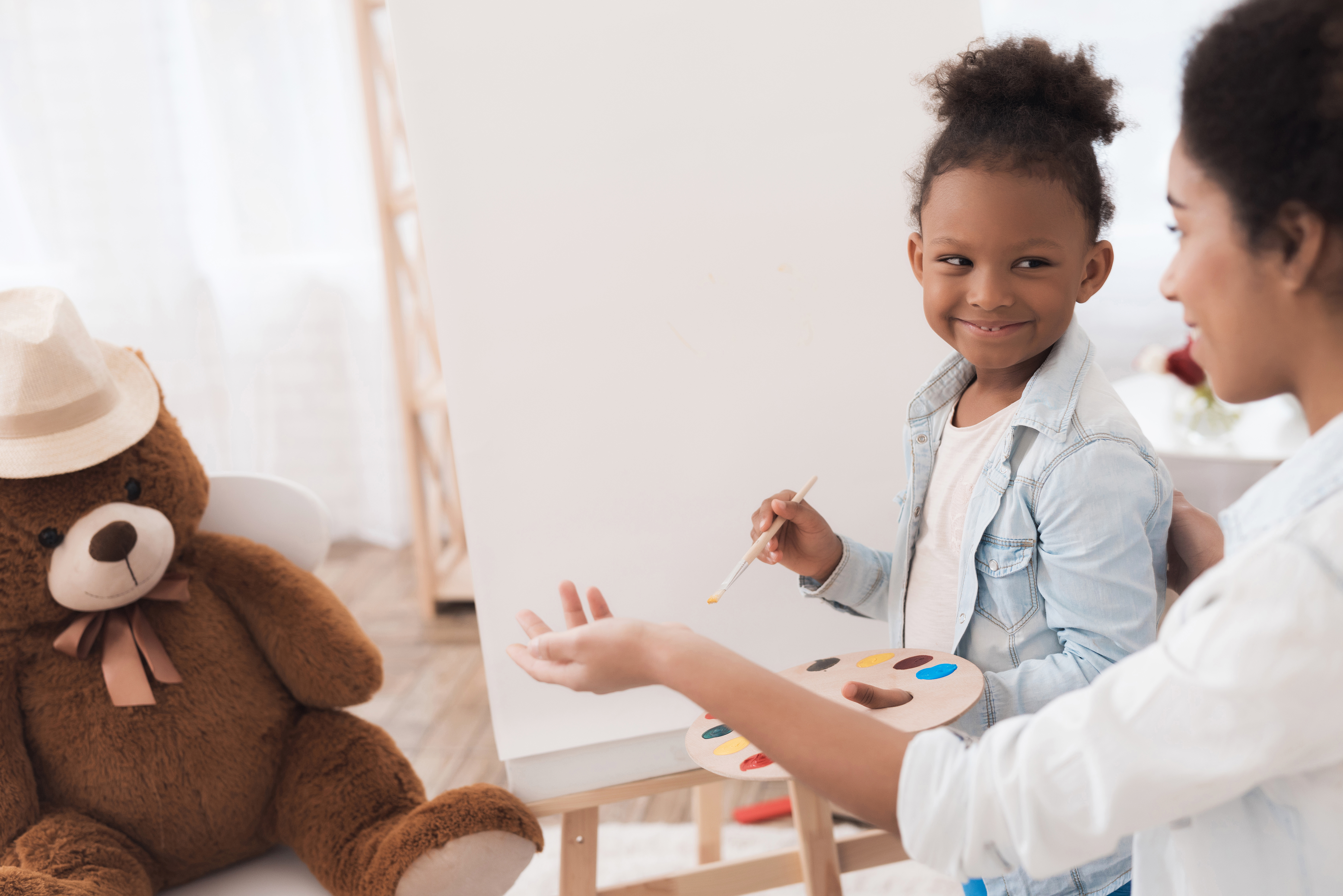Young Woman Little Girl Draw Together